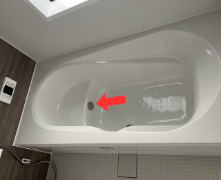 Bathtub outlet cautioned in red